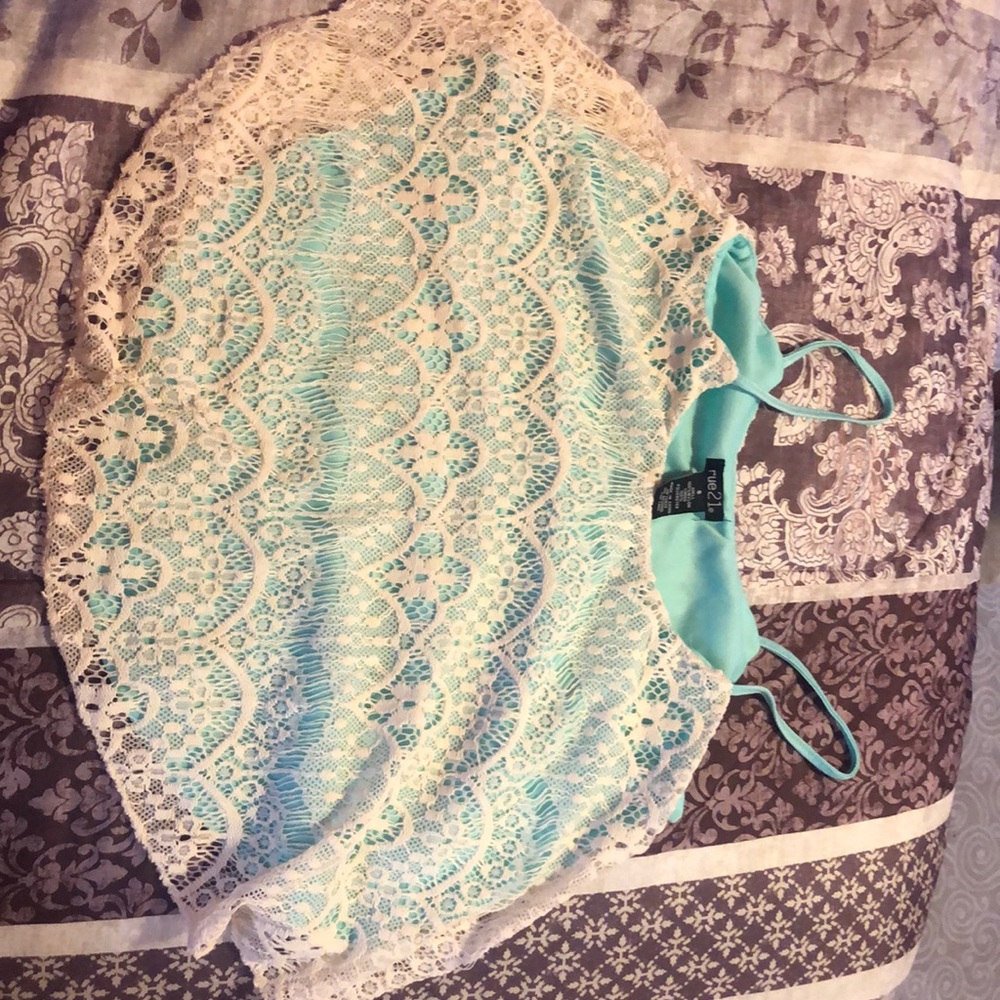 Turquoise and cream colored crop top
